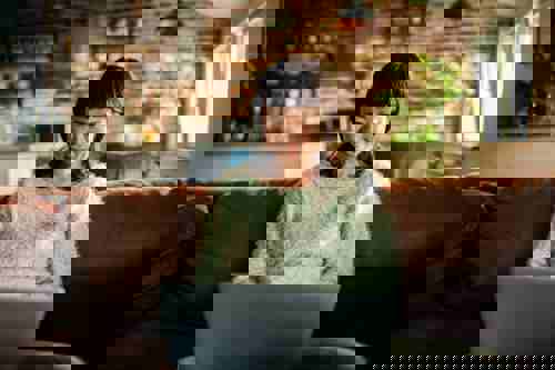 Moving Abroad, Woman Looking at Globe Deciding Where to Move